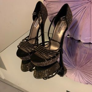 Gold and black heels